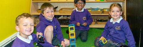 For boys from early years building a tower from some blocks
