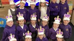 Children wearing crowns to celebrate the coronation
