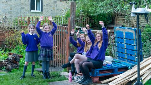 Group of girls , hands in the air , In the nature Garden